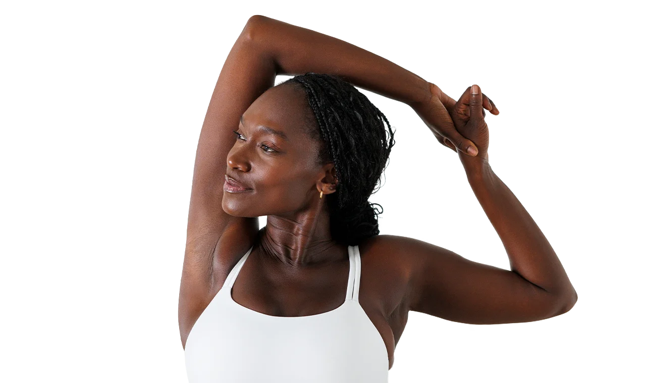 Woman showing smooth underarm after laser hair removal treatment