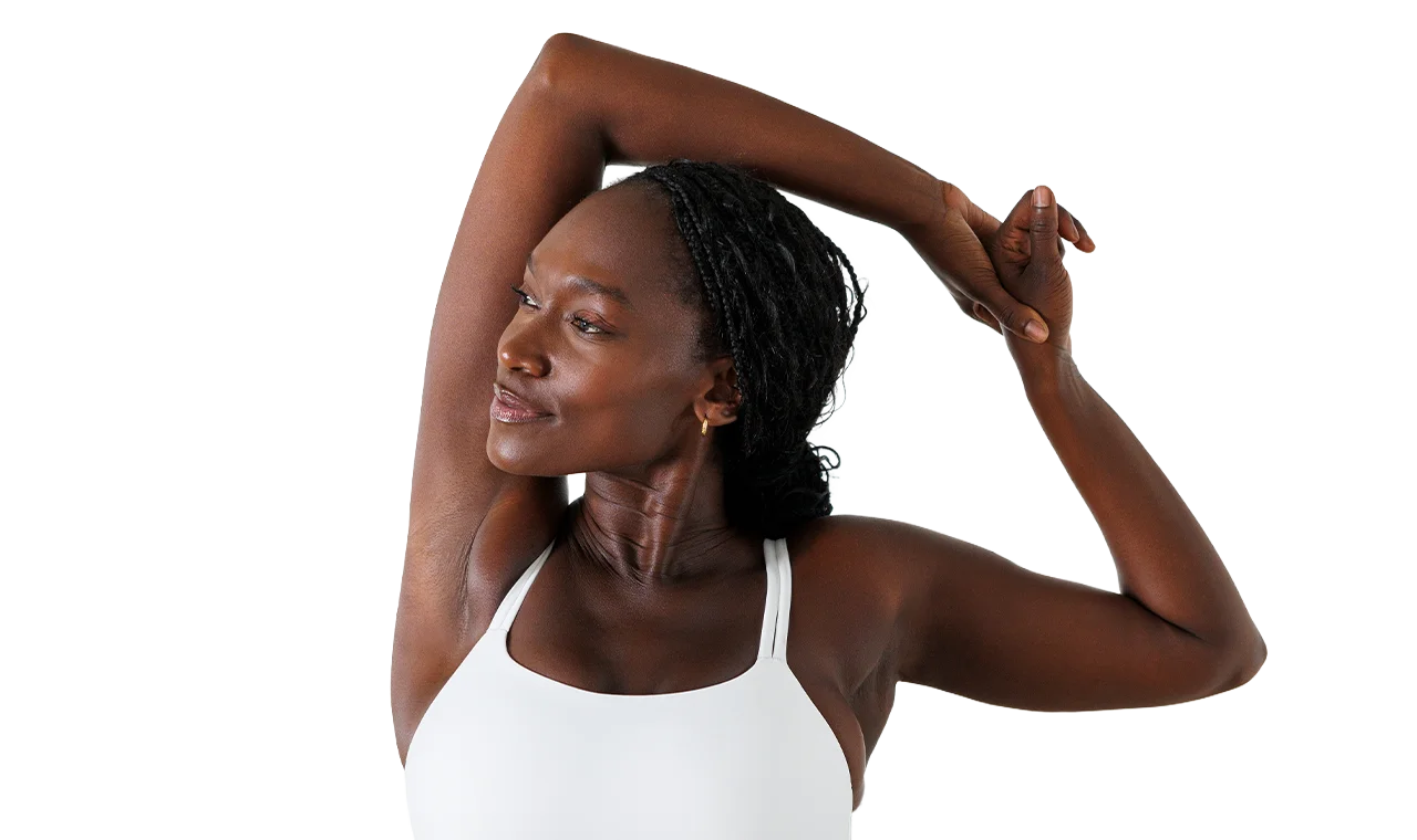 Woman showing smooth underarm after laser hair removal treatment
