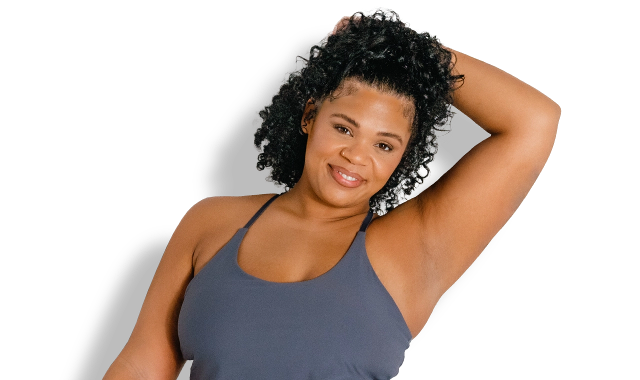 Woman showing smooth underarm after laser hair removal treatment