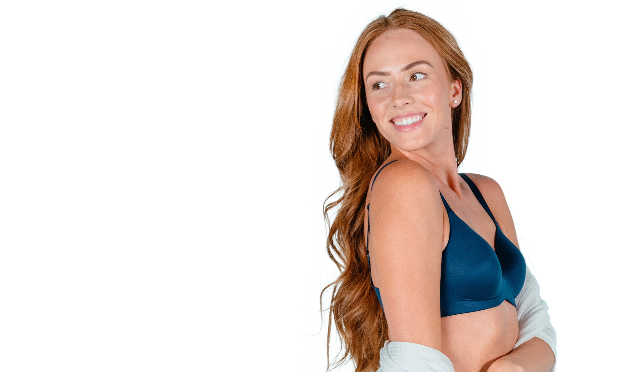 Woman showing smooth underarm after laser hair removal treatment