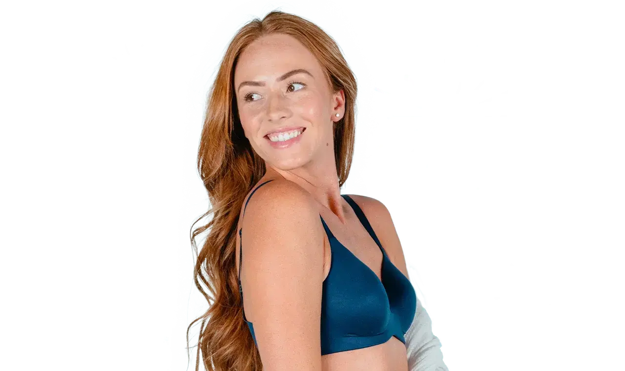 Woman showing smooth underarm after laser hair removal treatment